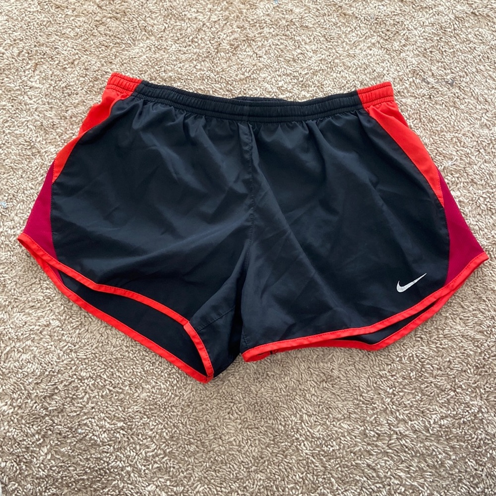 These are Nike women’s dry fit shorts in the size medium, they’re black and red.